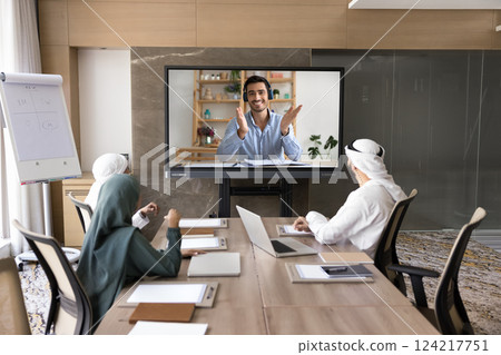 Latin businessman leads virtual meeting with Arabian partners colleagues Latin businessman leads virtual meeting with Arabian partners colleagues 124217751
