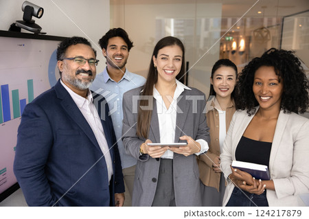 Multiethnic business team and young female leader standing for portrait 124217879