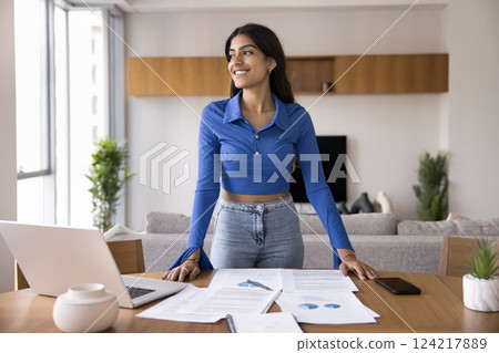 Woman reflects on completed task, feels satisfied with productive work Woman reflects on completed task, feels satisfied with productive work 124217889