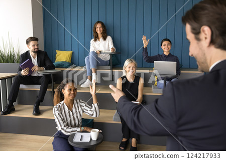 Young African woman raise her arm voting during seminar 124217933