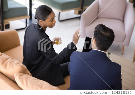 Two colleagues lead professional discussion in coworking space 124218185