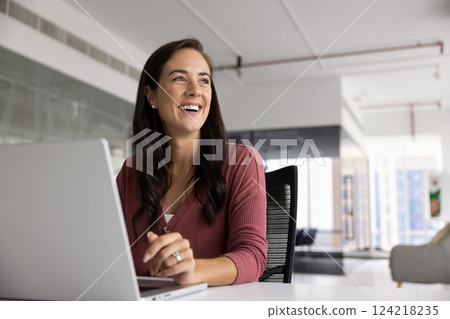 Happy successful Latin business leader woman working on project Happy successful Latin business leader woman working on project 124218235