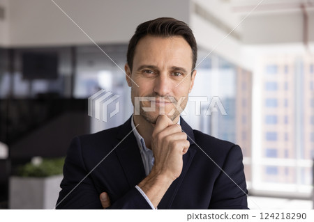 Positive Latin business CEO man posing for head shot Positive Latin business CEO man posing for head shot 124218290