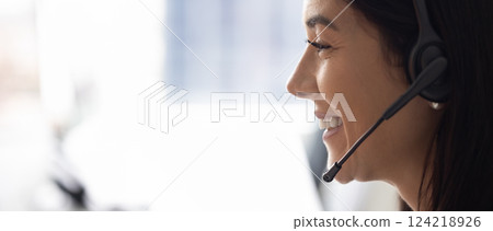 Facial banner portrait of telephone sales agent talking to customer 124218926