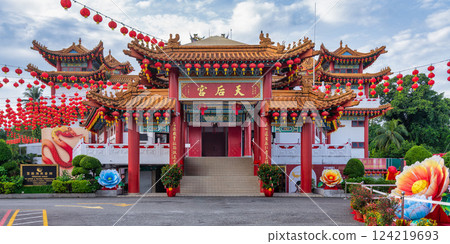 Thean Hou Temple, in Kuala Lumpur, Malaysia, showcases intricate architecture surrounded by colorful floral decorations 124219693
