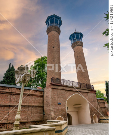 Juma Mosque of Ganja, Azerbaijan, with its two tall minarets and red bricks facade Juma Mosque of Ganja, Azerbaijan, with its two tall minarets and red bricks facade 124219695