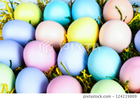 Bright Easter Celebration Close Up Of Pastel Eggs In Spring Green Grass Pink, Blue, Lavender Eggs For Holiday Decor Festive Vibe Bright Easter Celebration Close Up Of Pastel Eggs In Spring Green Grass Pink, Blue, Lavender Eggs For Holiday Decor Festive Vibe 124219809