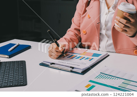 Cropped image of professional businesswoman working at her office via laptop, young female manager using portable computer device while sitting at modern loft, flare light, work process concept Cropped image of professional businesswoman working at her office via laptop, young female manager using portable computer device while sitting at modern loft, flare light, work process concept 124221004