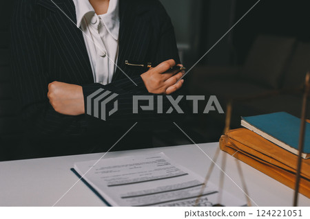 Judge gavel with Justice lawyers having team meeting at law firm background. Concepts of Law and Legal services. Judge gavel with Justice lawyers having team meeting at law firm background. Concepts of Law and Legal services. 124221051