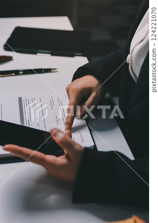 Judge gavel with Justice lawyers having team meeting at law firm background. Concepts of Law and Legal services. 124221070