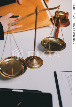 Judge gavel with Justice lawyers having team meeting at law firm background. Concepts of Law and Legal services. Judge gavel with Justice lawyers having team meeting at law firm background. Concepts of Law and Legal services. 124221090