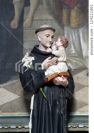 Saint Anthony of Padua holds baby Jesus, statue on the altar of Saint Blaise at Saint Nicholas Parish Church in Gusce, Croatia Saint Anthony of Padua holds baby Jesus, statue on the altar of Saint Blaise at Saint Nicholas Parish Church in Gusce, Croatia 124221801