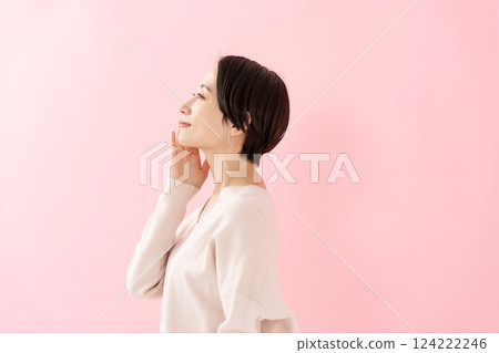 Woman touching her cheek, beauty, moisturizing, profile 124222246