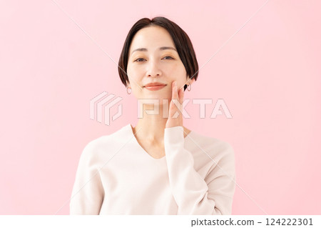Woman touching her cheek Beauty Moisture 124222301