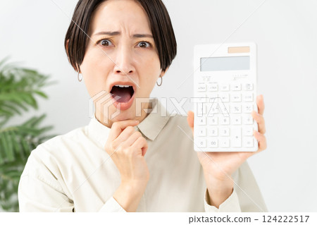 A woman with a calculator Trouble 124222517