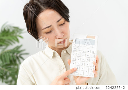 A woman with a calculator Trouble 124222542