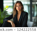 Full-body portrait of a stylish businesswoman in a Y2K-inspired office. 124222558