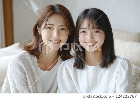Cute teenage high school girl and her mother in her 40s. Smiling Japanese parent and child 124222767