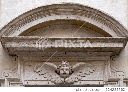 Angel on the portal of San Giovanni della Pigna Church in Rome, Italy Angel on the portal of San Giovanni della Pigna Church in Rome, Italy 124223362