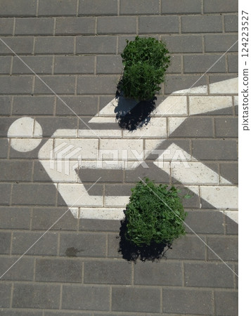 Pedestrian Symbol with Green Microgreens as Kneepads 124223527