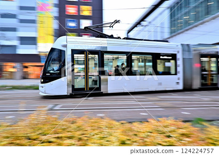 Portram tram running in front of Toyama Station 124224757