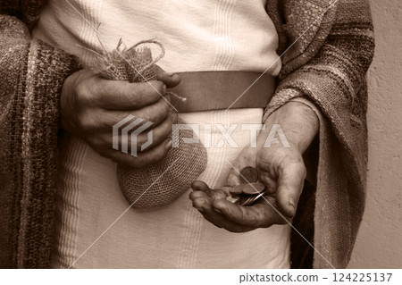 Ancient man with silver coins 124225137