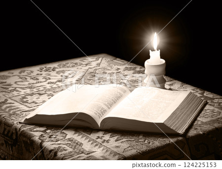 Big old bible and candle Big old bible and candle 124225153