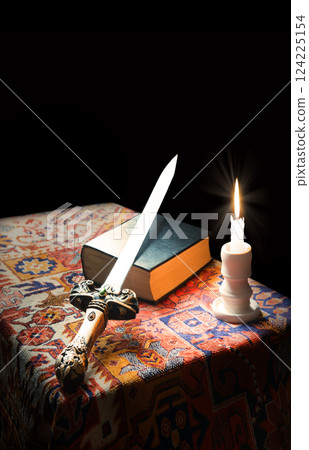 Iron sword on old bible Iron sword on old bible 124225154