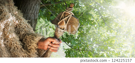Old hand with stone axe Old hand with stone axe 124225157