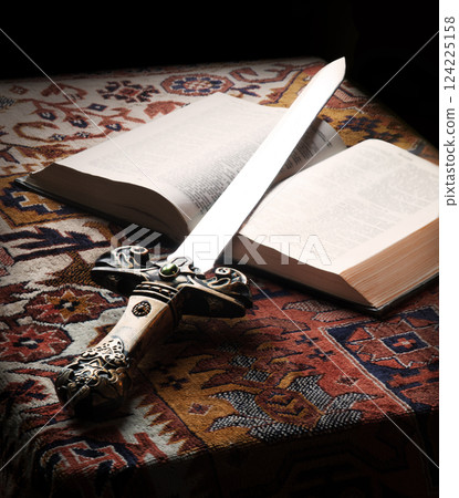 Old sword on the bible Old sword on the bible 124225158