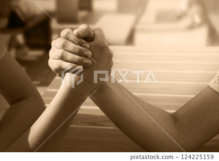 Hand wrestling contest of two girls 124225159