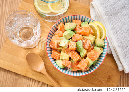 Salmon and avocado poke bowl 124225311