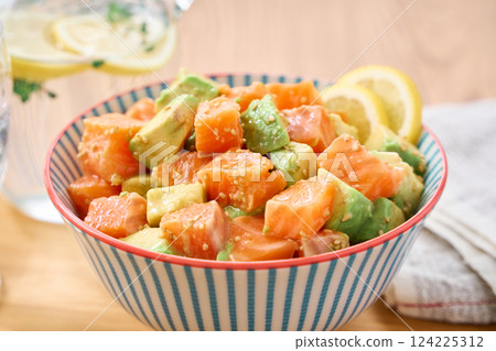 Salmon and avocado poke bowl 124225312