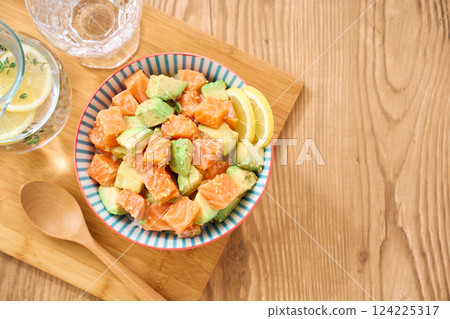 Salmon and avocado poke bowl Salmon and avocado poke bowl 124225317
