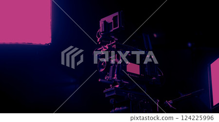 Film or video production setup with high end professional cinema cameras lighting camera rig and crew members working on set. Behind the scenes or BTS video shoot in a studio for cinematic visuals. Film or video production setup with high end professional cinema cameras lighting camera rig and crew members working on set. Behind the scenes or BTS video shoot in a studio for cinematic visuals. 124225996