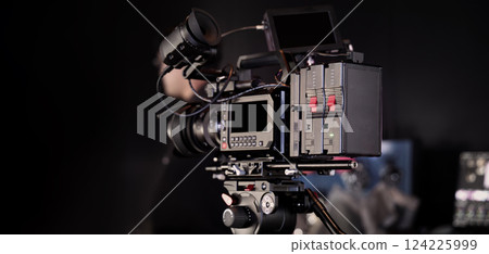 Film or video production setup with high end professional cinema cameras lighting camera rig and crew members working on set. Behind the scenes or BTS video shoot in a studio for cinematic visuals. Film or video production setup with high end professional cinema cameras lighting camera rig and crew members working on set. Behind the scenes or BTS video shoot in a studio for cinematic visuals. 124225999