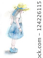 A cute girl wearing a straw hat facing backwards 124226115