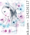 A cute girl tilting her head while holding flowers and a hand on her cheek 124226117