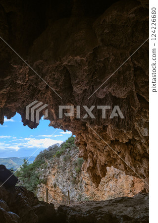 View of the exit from the cave in the mountains View of the exit from the cave in the mountains 124226680