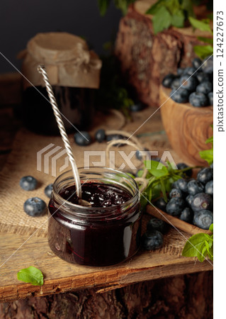 Blueberry jam with fresh berries. 124227673