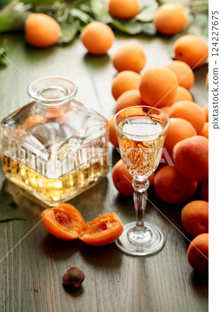 Apricot liquor with fresh fruits. Apricot liquor with fresh fruits. 124227675