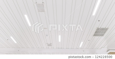 Ceiling mounted cassette type air conditioner and modern lamp light on a white ceiling. duct air conditioner for office or home Ceiling mounted cassette type air conditioner and modern lamp light on a white ceiling. duct air conditioner for office or home 124228500