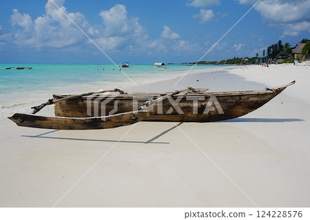 Fishing boat on jambiani beach at Indian Ocean in African Zanzibar island in Tanzania 124228576