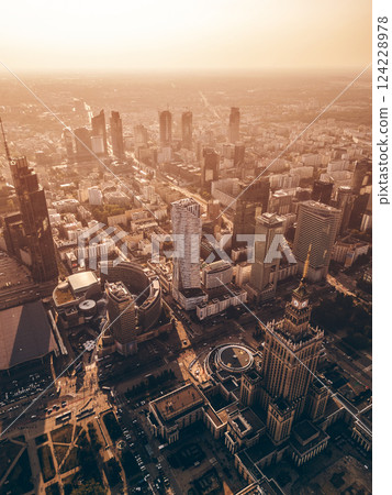 downtown of big capital city with skyscraper towers and modern tall office buildings, skyline and contemporary architecture of financial district, Warsaw, Poland, aerial top view downtown of big capital city with skyscraper towers and modern tall office buildings, skyline and contemporary architecture of financial district, Warsaw, Poland, aerial top view 124228978