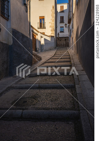 ancient stairs with pavement of old cozy European town, Cuenca, Spain 124228988
