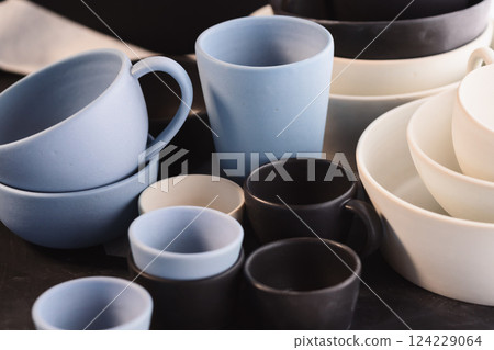 Matt ceramic handmade tableware in a workshop closeup Matt ceramic handmade tableware in a workshop closeup 124229064
