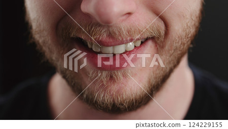 closeup shot of bearded man mouth smile 124229155