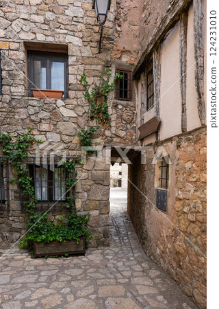 cozy narrow streets of ancient Roman town Medinaceli showcase ancient cobblestone architecture and peaceful ambiance 124231010