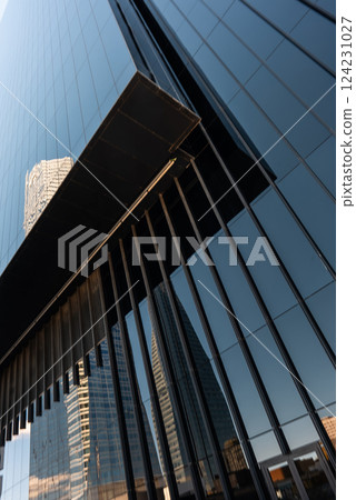 modern minimalistic architecture with glass facades and mirrors in vibrant urban setting during bright daylight, skyscrapers of Cuatro Torres area, Madrid modern minimalistic architecture with glass facades and mirrors in vibrant urban setting during bright daylight, skyscrapers of Cuatro Torres area, Madrid 124231027