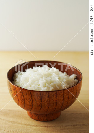 Rice served in a wooden bowl Rice served in a wooden bowl 124231885